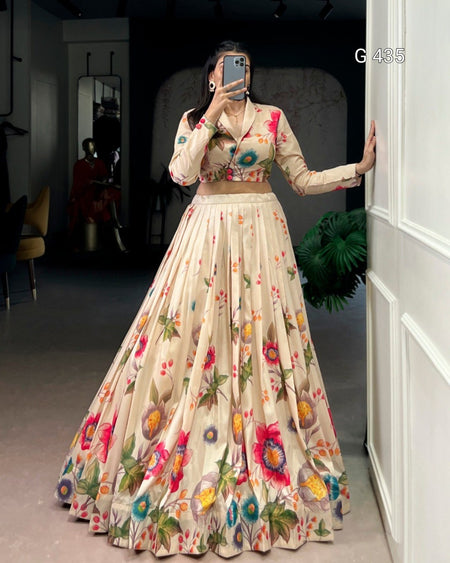 Person wearing a floral dress standing in a room with a white door.